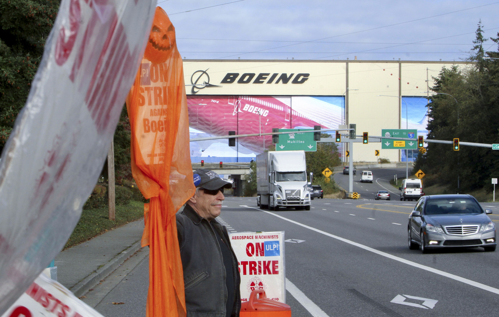 Boeing reports $6 billion quarterly loss as striking workers vote whether to accept contract offer