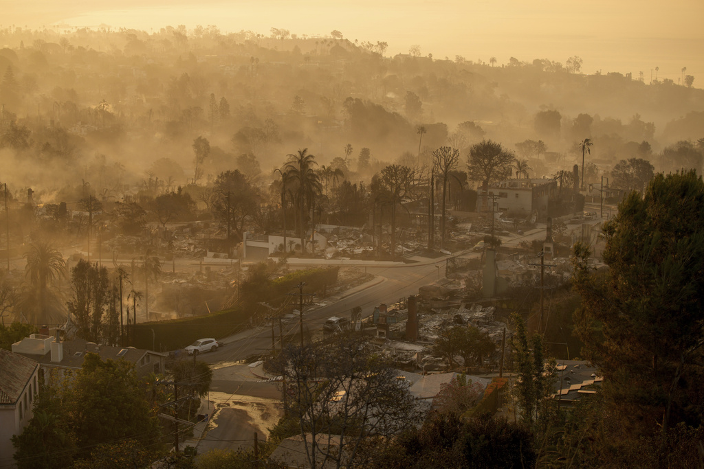 Families in shock begin to visit their charred homes in the Los Angeles area