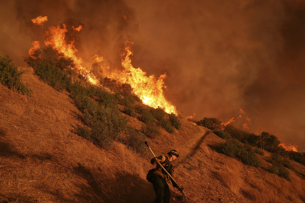 16 dead, 16 missing as fire crews try to corral Los Angeles blazes before winds return this week