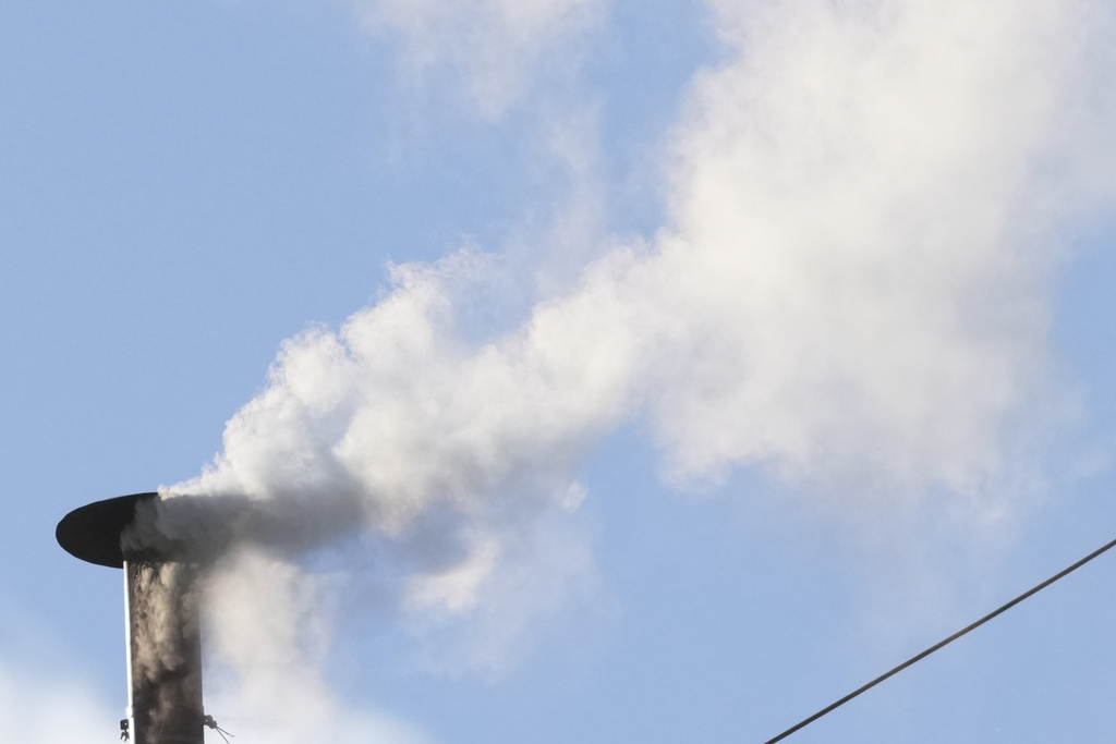White smoke pours out of the Sistine Chapel chimney, signaling the election of a new pope