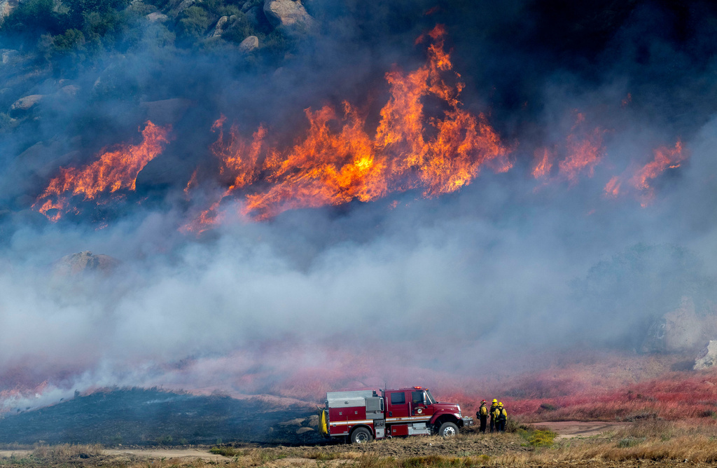 Crews battle fast-growing wildfire in windy Southern California that’s forced some to evacuate