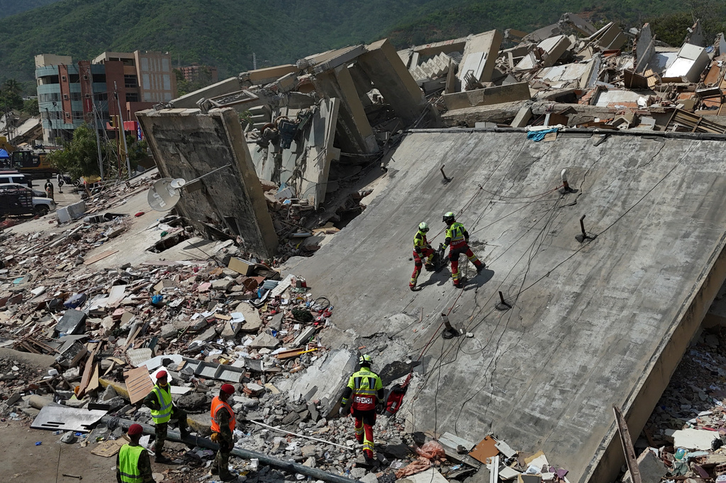 A strong aftershock rattles Venezuela as rescue workers race to find survivors