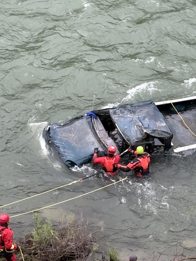 Truck careens through guardrail and rolls into Snake River